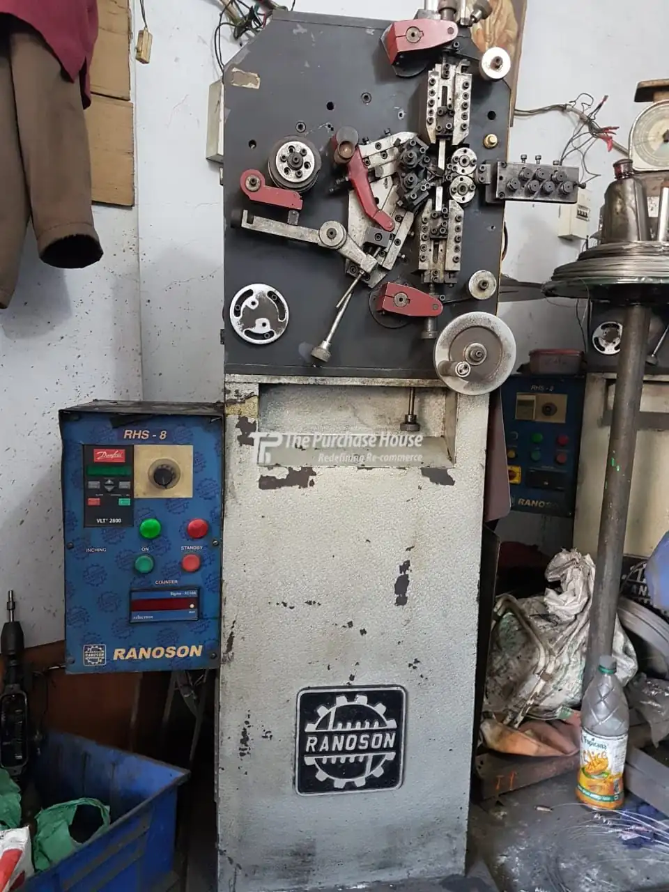 Automatic spring manufacturing and coiling setup system