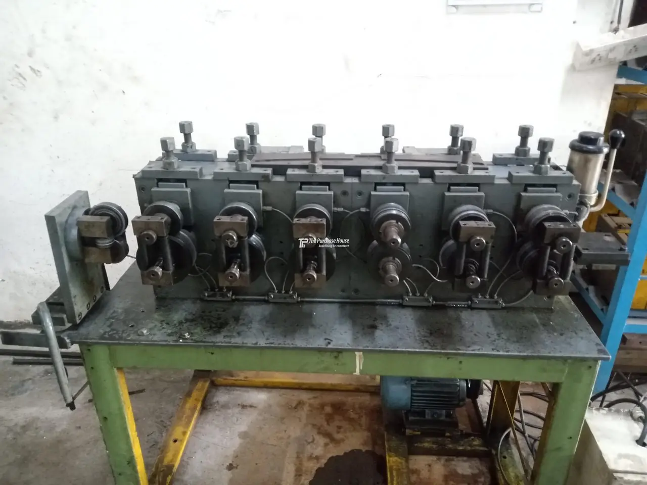 Roll forming machine for metal sheet profiles