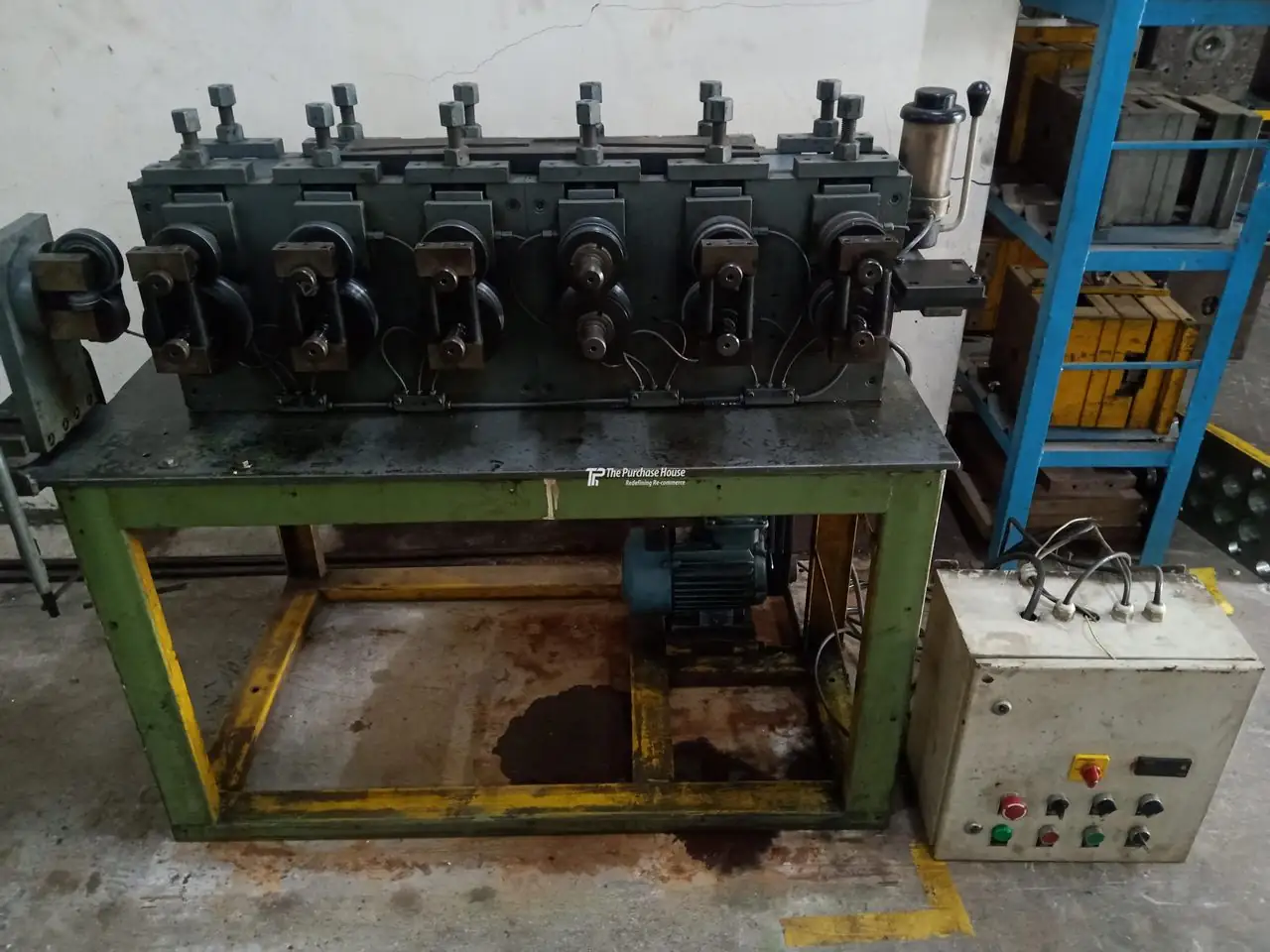 Roll forming machine for metal sheet profiles