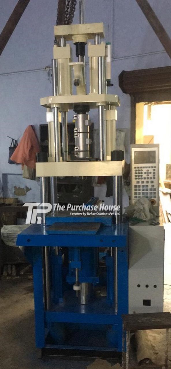 VERTICAL INJECTION MOULDING MACHINE