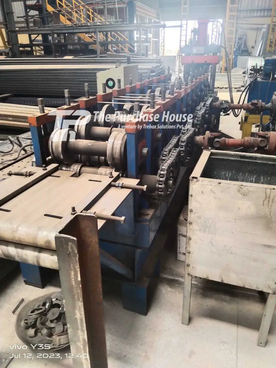 Roll forming production line and machine for metal sheets