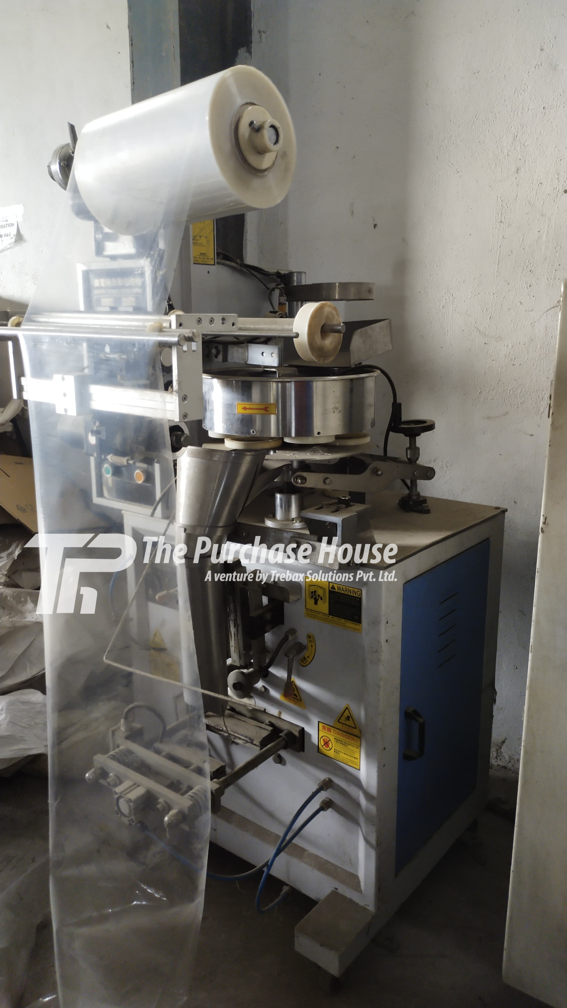 AUTOMATIC POUCH PACKAGING MACHINE