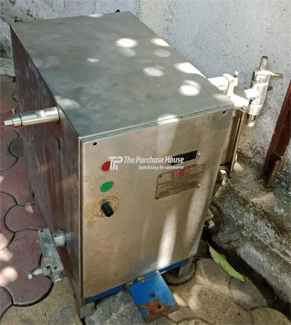 VOLUMETRIC LIQUID FILLING MACHINE